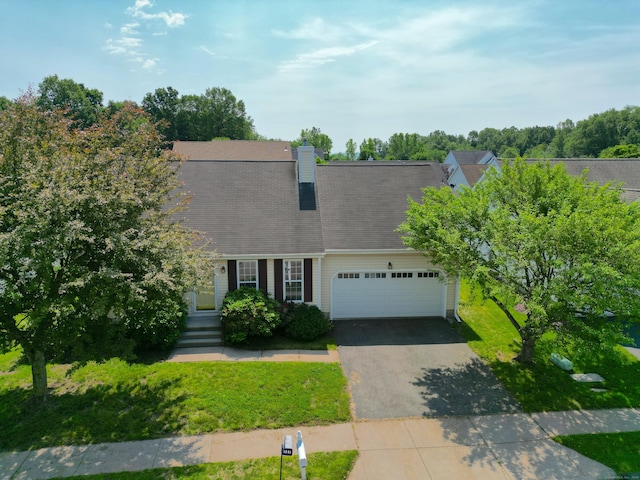 46 Rolling Grn, Middletown, CT 06457 - view of front of property with driveway, an attached garage, a chimney, and a front lawn