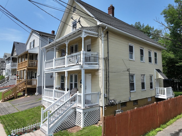 39 S Ave, Meriden, CT 06451 - view of home's exterior with a balcony, covered porch, and a chimney