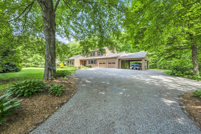 15 Quigley Rd, Wallingford, CT 06492 - view of front of home with asphalt driveway, a garage, and an attached carport