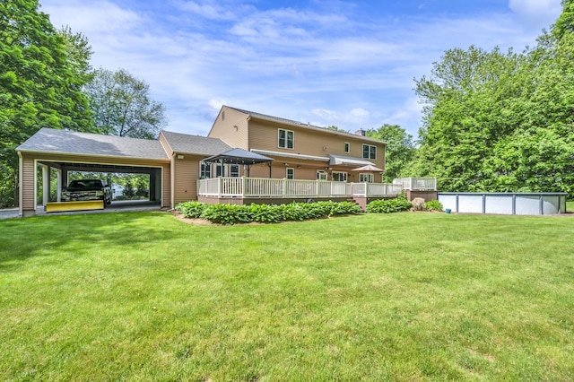 15 Quigley Rd, Wallingford, CT 06492 - rear view of property featuring a wooden deck, an outdoor pool, and a lawn