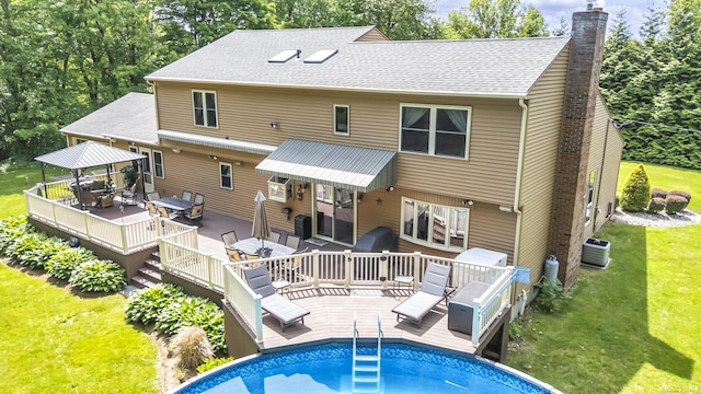 15 Quigley Rd, Wallingford, CT 06492 - rear view of property with a wooden deck, a gazebo, outdoor dining space, a chimney, and a lawn