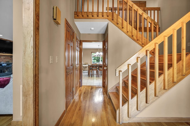 15 Quigley Rd, Wallingford, CT 06492 - foyer with stairs, wood finished floors, and a chandelier