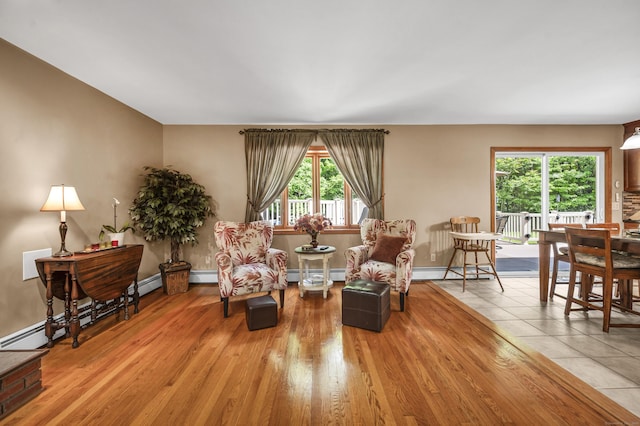 15 Quigley Rd, Wallingford, CT 06492 - living area featuring baseboard heating and light wood-style floors