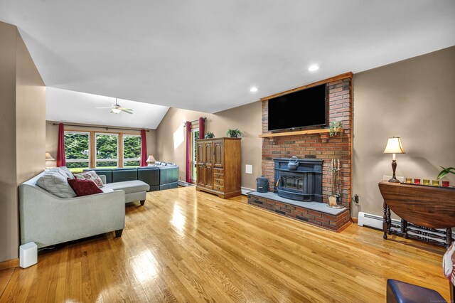 15 Quigley Rd, Wallingford, CT 06492 - living area featuring wood finished floors, lofted ceiling, ceiling fan, a wood stove, and recessed lighting