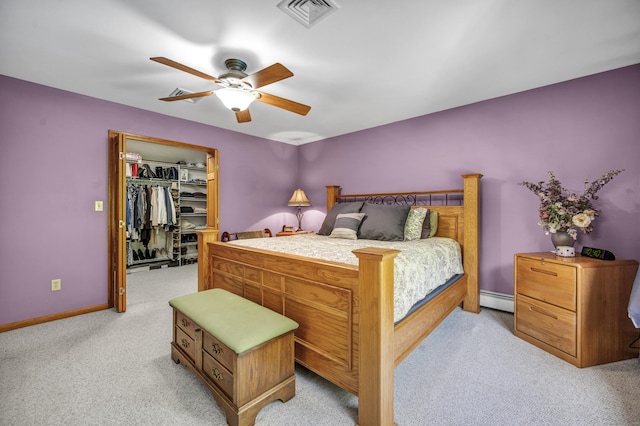 15 Quigley Rd, Wallingford, CT 06492 - bedroom featuring a baseboard radiator, light carpet, a walk in closet, ceiling fan, and a closet