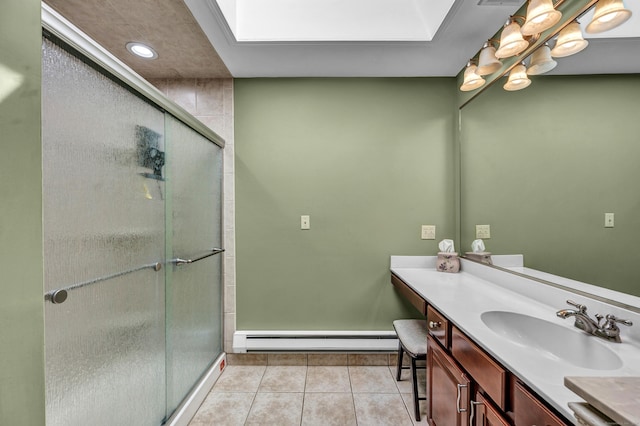 15 Quigley Rd, Wallingford, CT 06492 - bathroom featuring a baseboard heating unit, vanity, a shower stall, tile patterned floors, and a skylight