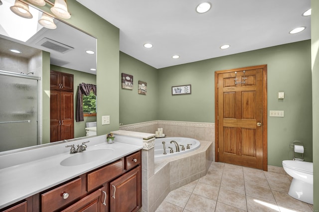 15 Quigley Rd, Wallingford, CT 06492 - bathroom featuring vanity, a garden tub, tile patterned flooring, a shower stall, and recessed lighting