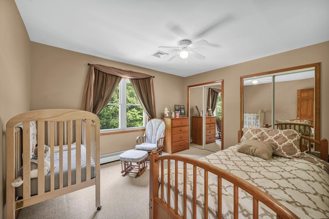 15 Quigley Rd, Wallingford, CT 06492 - carpeted bedroom with two closets, a ceiling fan, and baseboard heating