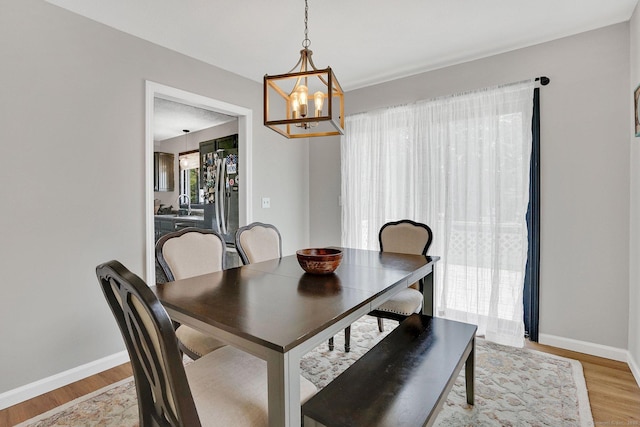 9 Renee Ln, Enfield, CT 06082 - dining room featuring a chandelier and light wood finished floors