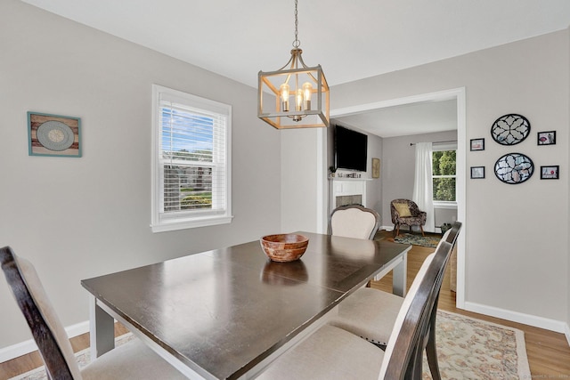 9 Renee Ln, Enfield, CT 06082 - dining room with light wood finished floors and a chandelier