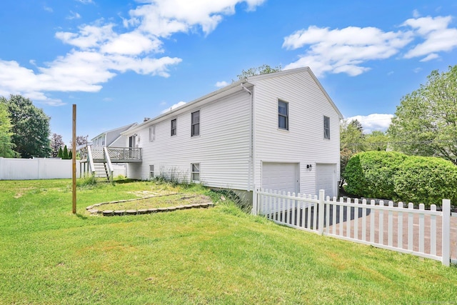 9 Renee Ln, Enfield, CT 06082 - back of property featuring a garage and stairway