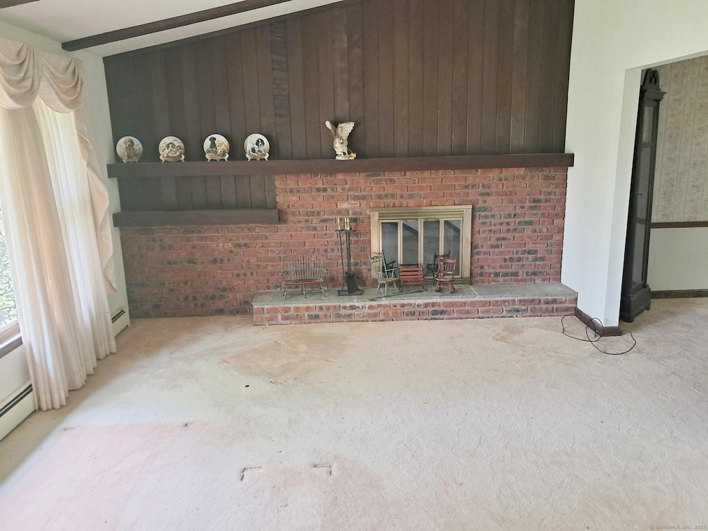 71 Blue Ridge Dr, Manchester, CT 06040 - unfurnished living room with carpet, a brick fireplace, and wooden walls