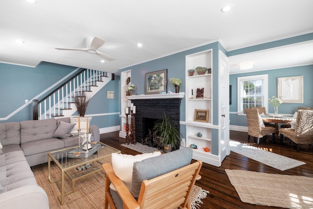 32 Holcomb St, West Haven, CT 06516 - living room with ornamental molding, stairs, wood finished floors, a fireplace, and recessed lighting