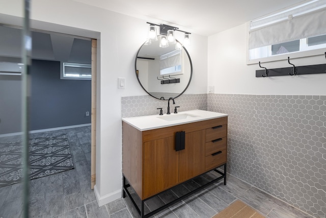 32 Holcomb St, West Haven, CT 06516 - bathroom featuring tile walls, vanity, and a wainscoted wall