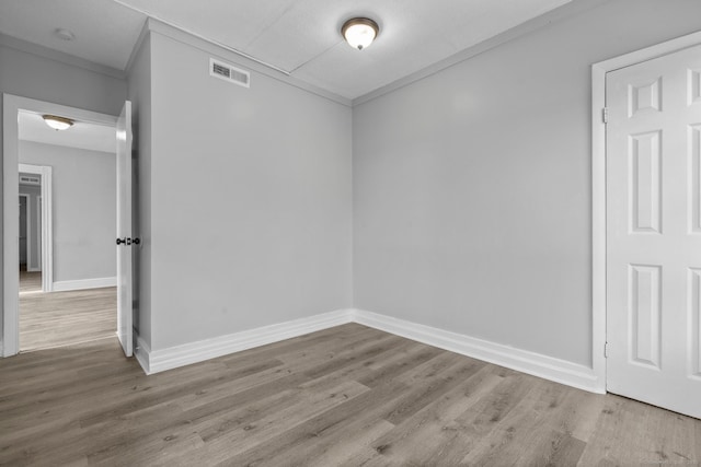 37 William St, Waterbury, CT 06702 - empty room with wood finished floors, crown molding, and a smoke detector