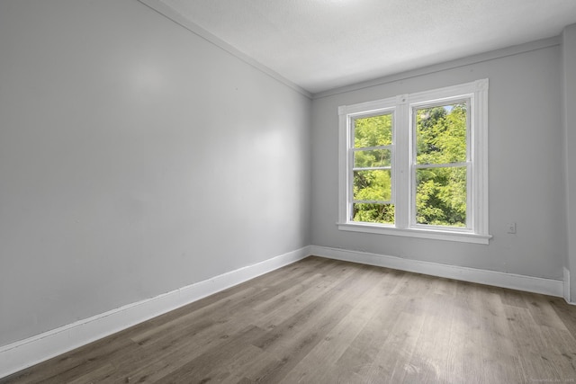 37 William St, Waterbury, CT 06702 - spare room with wood finished floors and crown molding