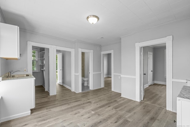 37 William St, Waterbury, CT 06702 - unfurnished dining area featuring crown molding and light wood-style flooring