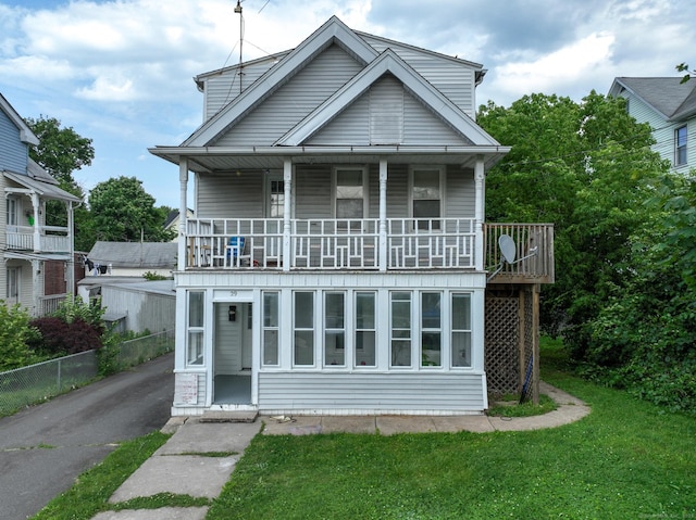 29 Olive St, New Britain, CT 06051 - view of front facade featuring a balcony and asphalt driveway