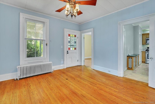 171 Lincoln St, Middletown, CT 06457 - empty room featuring radiator, ornamental molding, ceiling fan, and light wood finished floors