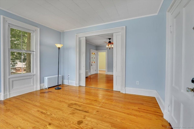 171 Lincoln St, Middletown, CT 06457 - unfurnished room with radiator heating unit, crown molding, light wood-style flooring, and ceiling fan