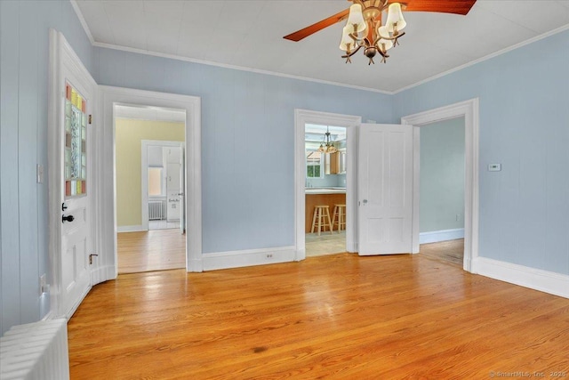 171 Lincoln St, Middletown, CT 06457 - empty room featuring ornamental molding, light wood-type flooring, a chandelier, and a ceiling fan