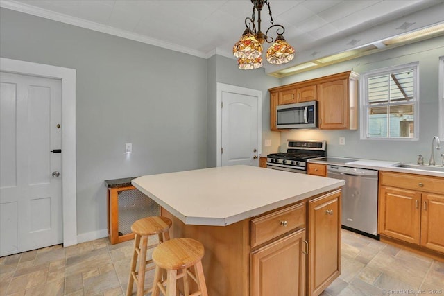 171 Lincoln St, Middletown, CT 06457 - kitchen with appliances with stainless steel finishes, stone finish floors, a center island, light countertops, and ornamental molding