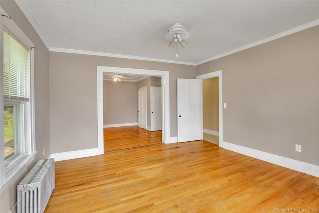 171 Lincoln St, Middletown, CT 06457 - spare room with radiator heating unit, ceiling fan, healthy amount of natural light, light wood-type flooring, and crown molding