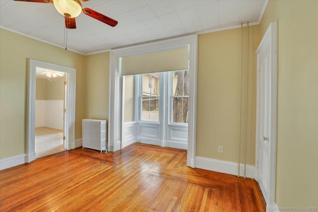 171 Lincoln St, Middletown, CT 06457 - spare room featuring radiator heating unit, a ceiling fan, ornamental molding, and light wood finished floors