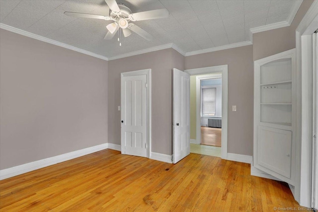 171 Lincoln St, Middletown, CT 06457 - unfurnished bedroom with light wood finished floors, radiator, a ceiling fan, and crown molding