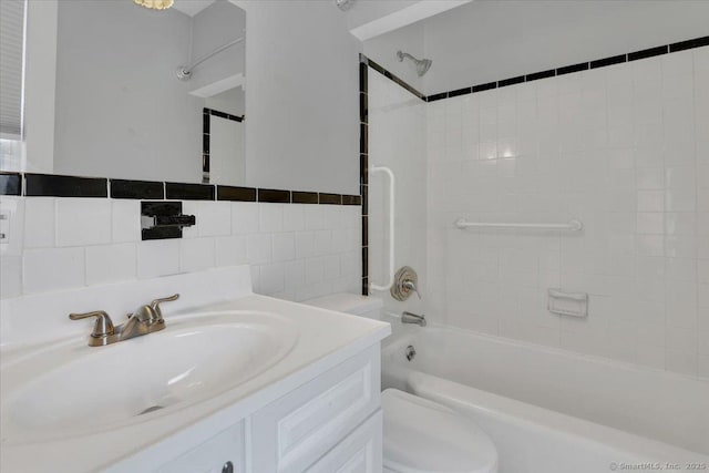 171 Lincoln St, Middletown, CT 06457 - bathroom with  shower combination, vanity, and tile walls