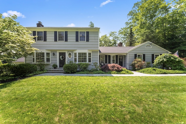 46 Tally Ho Rd, Ridgefield, CT 06877 - colonial home featuring a chimney and a front yard