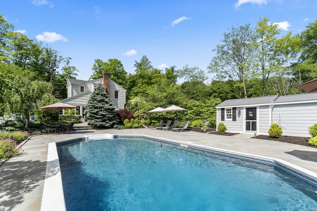 46 Tally Ho Rd, Ridgefield, CT 06877 - outdoor pool featuring an outbuilding and a patio