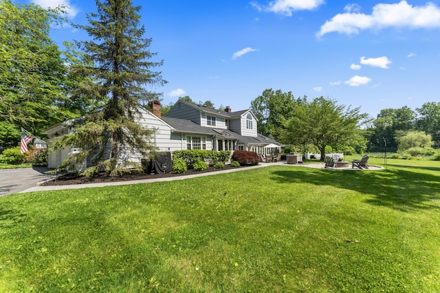 46 Tally Ho Rd, Ridgefield, CT 06877 - view of front of house featuring a front lawn and a chimney