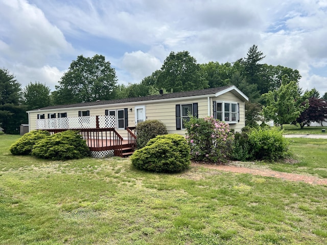 26 Jacqueline Ln, Windham, CT 06256 - manufactured / mobile home featuring a front lawn and a wooden deck