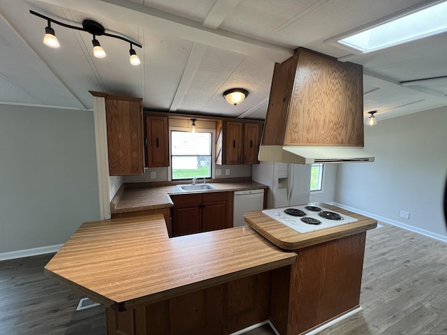 26 Jacqueline Ln, Windham, CT 06256 - kitchen featuring white appliances, dark wood-style flooring, lofted ceiling, ventilation hood, and a peninsula
