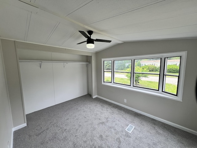 26 Jacqueline Ln, Windham, CT 06256 - unfurnished bedroom with carpet flooring, lofted ceiling, a closet, and ceiling fan
