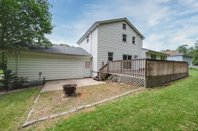 140 Braeside Dr, Hamden, CT 06514 - back of house featuring a fire pit, a wooden deck, a lawn, and a patio
