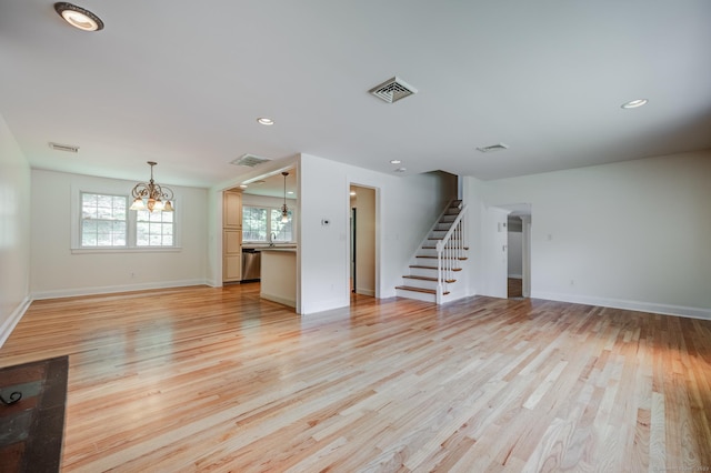 140 Braeside Dr, Hamden, CT 06514 - unfurnished living room featuring a chandelier, stairway, light wood-style floors, and recessed lighting