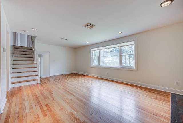 140 Braeside Dr, Hamden, CT 06514 - spare room featuring wood finished floors, stairway, and recessed lighting