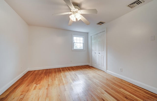140 Braeside Dr, Hamden, CT 06514 - unfurnished bedroom with light wood-type flooring, a closet, and a ceiling fan