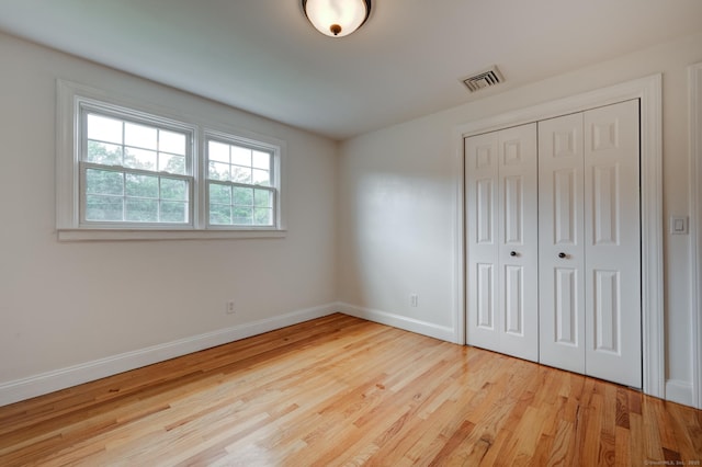 140 Braeside Dr, Hamden, CT 06514 - unfurnished bedroom featuring wood finished floors and a closet