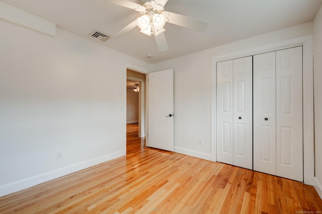 140 Braeside Dr, Hamden, CT 06514 - unfurnished bedroom with light wood-style floors, a closet, and a ceiling fan