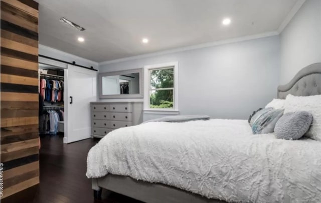 17 Kingsbury Rd, Norwalk, CT 06851 - bedroom with crown molding, a spacious closet, dark wood-type flooring, recessed lighting, and a closet