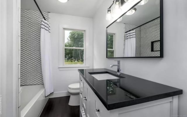 17 Kingsbury Rd, Norwalk, CT 06851 - bathroom with vanity, shower / bath combo with shower curtain, and wood finished floors
