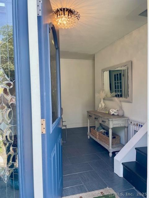 17 Kingsbury Rd, Norwalk, CT 06851 - property entrance featuring radiator heating unit and a balcony