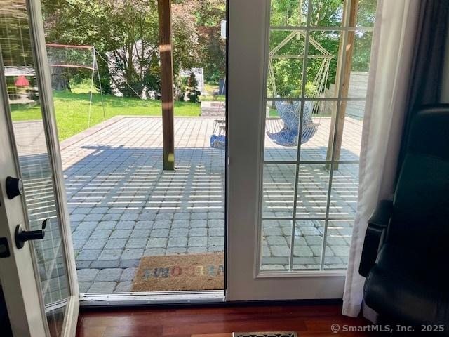 17 Kingsbury Rd, Norwalk, CT 06851 - doorway to outside featuring wood finished floors