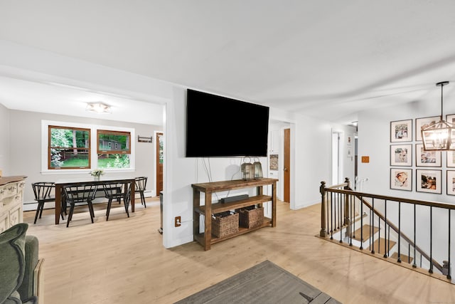 43 Phelps Rd, Marlborough, CT 06447 - living room with a chandelier, light wood-style flooring, and baseboard heating