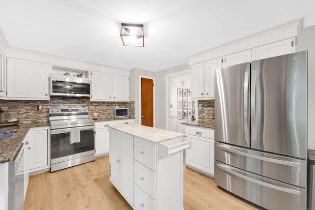 43 Phelps Rd, Marlborough, CT 06447 - kitchen with stainless steel appliances, tasteful backsplash, light wood finished floors, and white cabinets