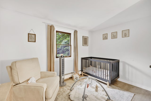 43 Phelps Rd, Marlborough, CT 06447 - bedroom featuring wood finished floors and a crib
