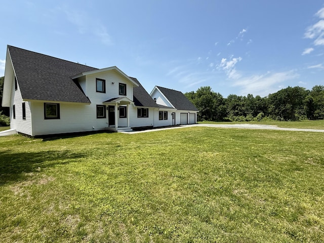 249 Wall St, Hebron, CT 06248 - view of front facade featuring an attached garage, a front lawn, a shingled roof, and asphalt driveway